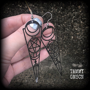 These earrings feature gorgeous esoteric crescent moon and pentagram designs, are super light weight and nice and dangly, weighing only a gram or two each, and measuring just over 9cms from tip to tip.
This pair has been made with stainless steel french hooks, to be worn through pierced ears.