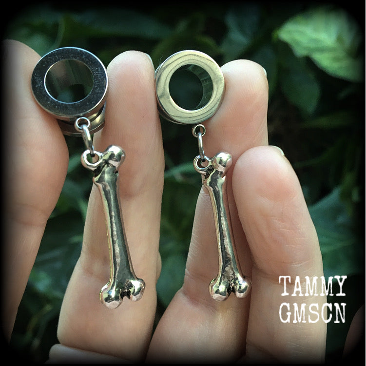 Bones tunnel earrings Leg bone earrings Bone tunnel earrings Halloween earrings Leg bones 00 gauge tunnels Gauged ears Gauges Stretched lobes Stretched ears Gauged ears Halloween jewelry Halloween gauges Horrorpunk earrings Horror punk jewelry Spooky cute Horror movie