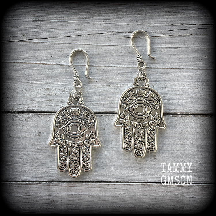 These antique silver Hamsa hand earrings weigh 10 grams each, measuring 7cms from tip to tip.
This pair has been made on small antique silver shephard hooks, suitable to be worn through stretched lobes with silicone earlets from 8 gauge (3mm).