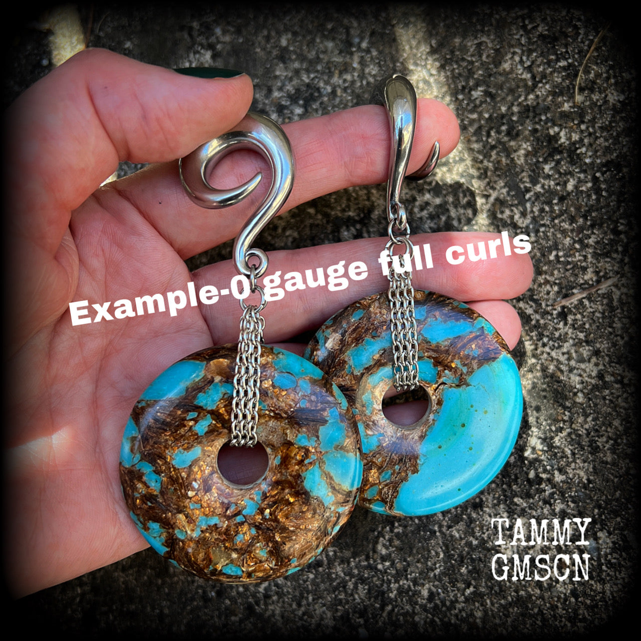 These earrings feature sky blue turquoise and bronzite gemstones cradled in antique silver chain. This pair weighs approx 32 grams a piece, and measure 10cms from tip to tip.
These have been made on 6 gauge (4mm) surgical steel full curl hooks.