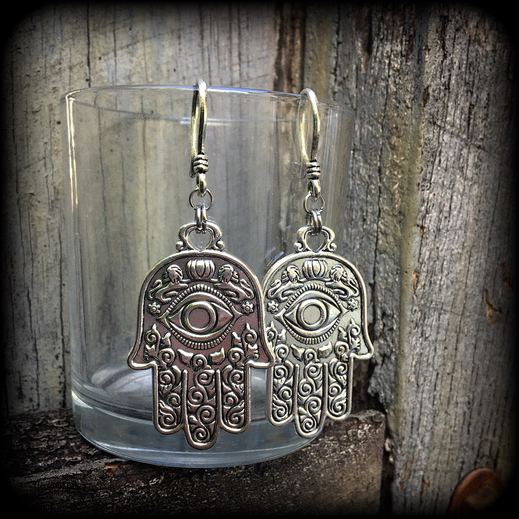 These antique silver Hamsa hand earrings weigh 10 grams each, measuring 7cms from tip to tip.
This pair has been made on small antique silver shephard hooks, suitable to be worn through stretched lobes with silicone earlets from 8 gauge (3mm).