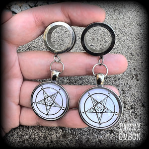 These gorgeous tunnel earrings feature classic black Sigil of Baphomet symbols on white background enclosed in resin, weighing in at approx 15 grams each and measuring just over 7 cms from tip to tip.

This pair have been made with 3/4" gauge (19mm) surgical steel screw fit tunnels, suitable for stretched lobes.