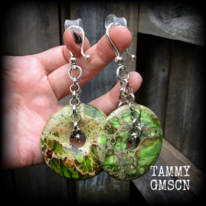 Featuring lime green ocean jasper donut gemstones, these earrings weigh in at approx 35 grams a piece, and hang just on 10cms from tip to tip.
This pair has been made with large antique silver shephard hooks, for stretched ears.