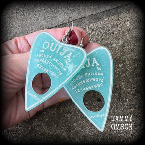 These gorgeous oversize baby blue pastel goth planchette earrings are big and dangly!!!
Weighing in at 8 grams each and measuring just under 8 cms from tip to tip.

This pair of earrings have been made on stainless steel french hooks, suitable for pierced ears.