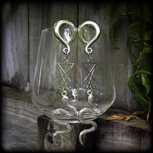 These gorgeous 'Snake and Sigil' gauged earrings feature an antique silver snake (Lilith) hanging from a stainless steel Sigil of Lucifer charm.
These are nice and dangly at 12cms from tip to tip and weigh approx 20 grams each, not too heavy.
This pair have been made on 0 gauge (8mm) surgical steel full curl hooks, suitable for stretched lobes.