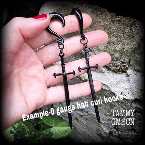 These gorgeous ear hangers feature a pitch black enamel sword pendant, measuring just on 12cms from tip to tip, and weighing approx 12 grams each.
This pair has been made on 0 gauge half curl hooks