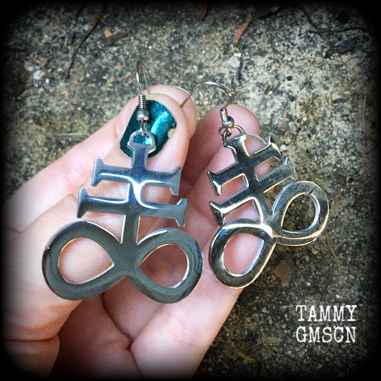 These gorgeous earrings feature large stainless steel Sigil of Sulphur pendants, measure just under 6 cms from tip to tip, and weigh approx 6 grams each.

This pair have been made with stainless steel french hooks, for pierced ears.