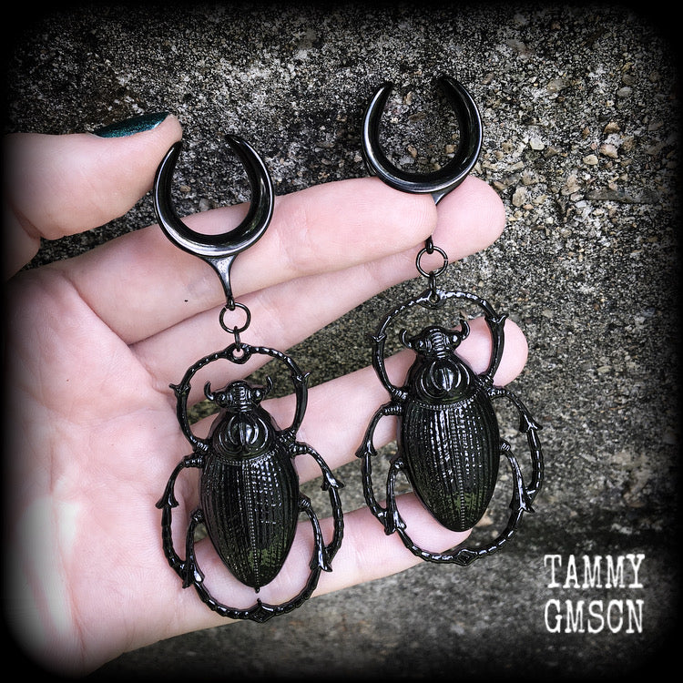 These gorgeous black enamel 'Scarab beetle' gauged earrings measure approx 9cms from tip to tip, and weigh approx. 16 grams a piece, not too heavy.
This pair has been made on 3/4" gauge (19mm) gauge surgical steel cradles, to be worn in stretched lobes.