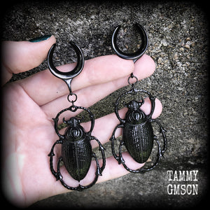 These gorgeous black enamel 'Scarab beetle' gauged earrings measure approx 9cms from tip to tip, and weigh approx. 16 grams a piece, not too heavy.
This pair has been made on 3/4" gauge (19mm) gauge surgical steel cradles, to be worn in stretched lobes.