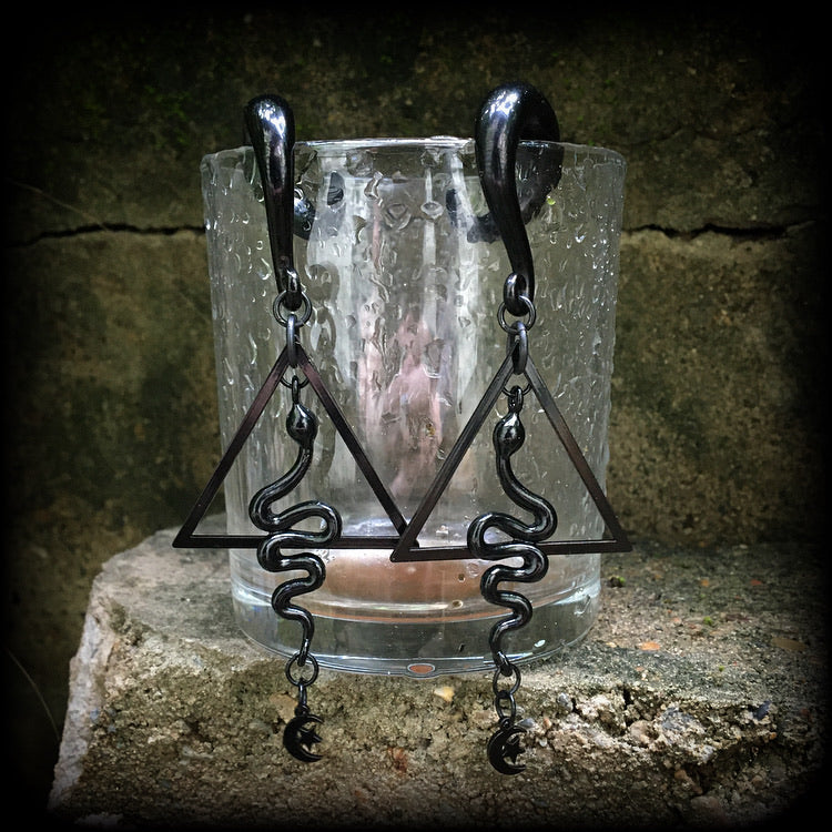 These gorgeous pitch black 'Ascending Snake' gauged earrings and are nice and dangly but not too big, weighing approx 18 grams each, and measuring around 10 cms from tip to tip.

This pair has been made on 0 gauge (8mm) surgical steel full curl hooks, suitable for stretched lobes.