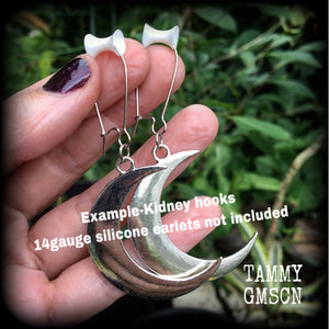 Crescent moon tunnel earrings