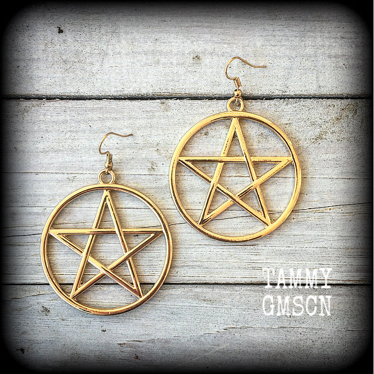 These are beautiful earrings feature large champagne gold pentagrams ,light weight (weighing only a few grams each) and nice and dangly, measuring just on 8cms from tip to tip.

This pair has been made on antique gold french hooks, suitable for pierced ears.