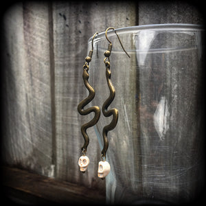 Bronze snake and stone skull earrings