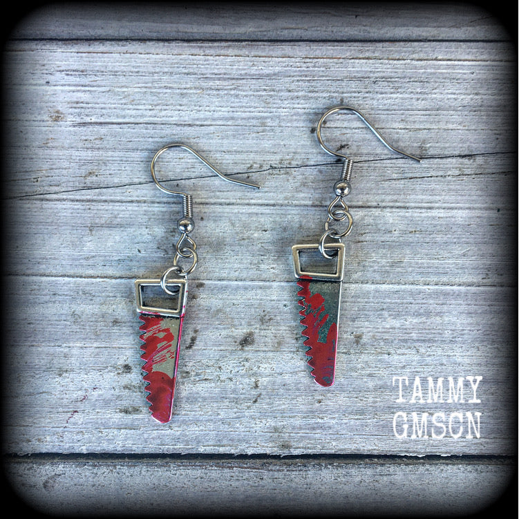 Bloodied bone saw earrings