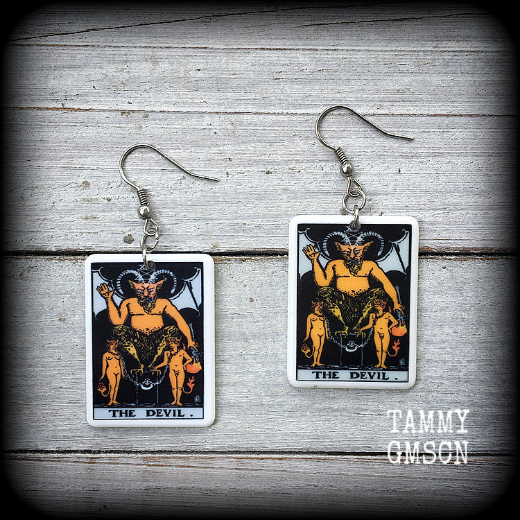 These earrings feature a lightweight Rider Waite ‘The Devil’ tarot card charm, measuring just over 6cms from tip to tip and weighing only a few grams each.

This pair has been made with stainless steel french hooks, for pierced ears.