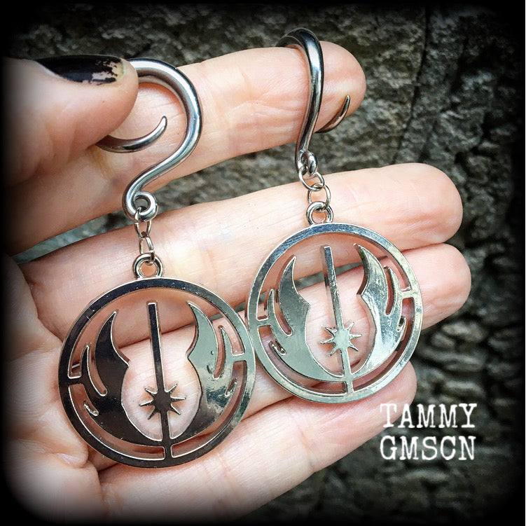 Featuring the symbol of the Jedi Order, these earrings are nice and lightweight at only 9 grams a piece, and measure just over 6cms from tip to tip, a must have for any Star Wars fan!

This pair has been made on 6 gauge (4mm) surgical steel full curls, to be worn in stretched lobes.