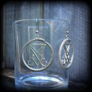 These gorgeous antique silver 'Ouroboros and Sigil of Lucifer' earrings are light weight at approx 5 grams a piece, and nice and dangly, measuring just over 5cms from tip to tip.
This pair has been made with stainless steel french hooks, suitable for pierced ears.