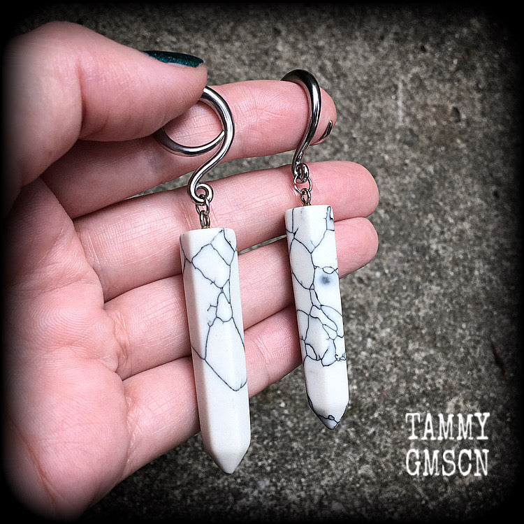 These earrings are made with beautiful white howlite stone points, measuring just on 8cms from tip to tip, and weighing approx 13grams each.
This pair has been made on 6 gauge (4mm) surgical steel full curl hooks, to be worn in stretched lobes.