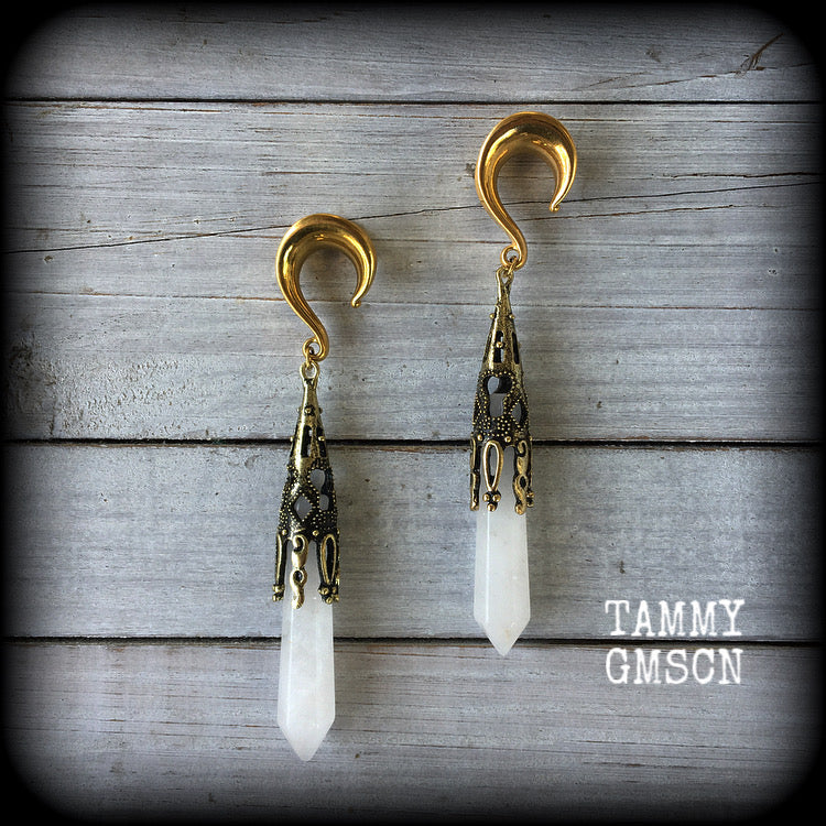 These gorgeous gothic gemstone gauged earrings feature beautiful cloudy quartz and antique bronze gemstone points, measuring just over 10 cms from tip to tip, and weighing approx 15 grams each.
These earrings have been made on 5/8" gauge (16mm) surgical steel saddles, to be worn in stretched lobes.