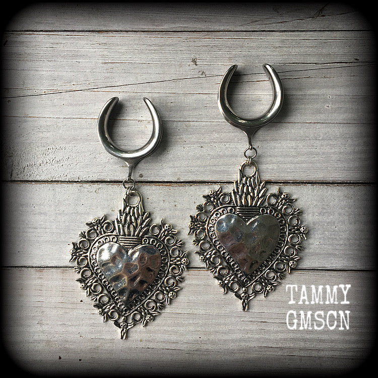 These gorgeous antique silver gauged earrings feature big beautiful sacred hearts, measuring 11cms from tip to tip, and weighing approx 21 grams each.

This pair has been made on 1" gauge (25mm) surgical steel cradles, to be worn in stretched lobes.