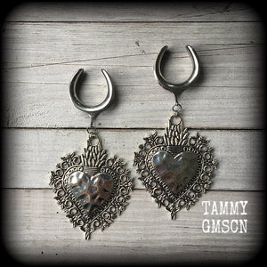 These gorgeous antique silver gauged earrings feature big beautiful sacred hearts, measuring 11cms from tip to tip, and weighing approx 21 grams each.

This pair has been made on 1" gauge (25mm) surgical steel cradles, to be worn in stretched lobes.