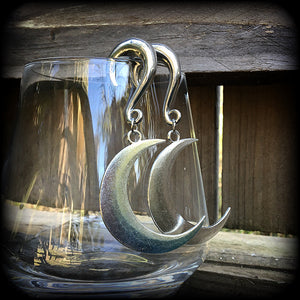 These gorgeously witchy antique silver 'Crescent moon' gauged earrings feature a classic antique silver crescent moon, measuring just under 8cms from tip to tip, and weighing approx 15 grams each.

This pair has been made on 0 gauge (8mm) surgical steel half curl hooks, to be worn in stretched lobes.