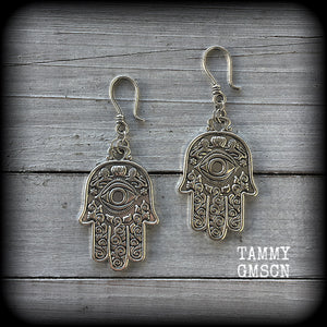 These antique silver Hamsa hand earrings weigh 10 grams each, measuring 7cms from tip to tip.
This pair has been made on small antique silver shephard hooks, suitable to be worn through stretched lobes with silicone earlets from 8 gauge (3mm).