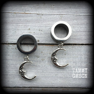 These gorgeous tunnel dangles feature whimsical antique silver crescent moons, are light weight, weighing in at 7 grams each and measure 4 cms from tip to tip.
This pair has been made with 9/16" (14mm) gauge surgical steel screw fit tunnels-suitable for stretched lobes.