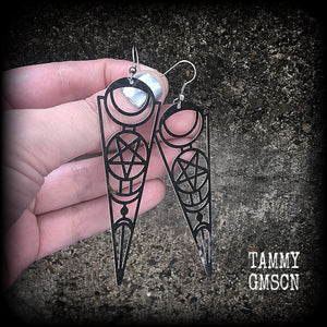 These earrings feature gorgeous esoteric crescent moon and pentagram designs, are super light weight and nice and dangly, weighing only a gram or two each, and measuring just over 9cms from tip to tip.
This pair has been made with stainless steel french hooks, to be worn through pierced ears.