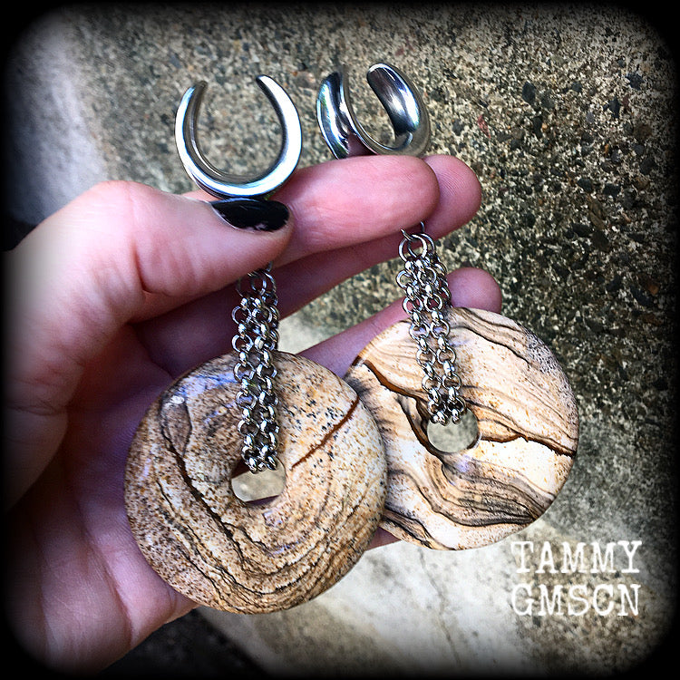 Featuring a pair of gorgeous streaky picture jasper donut gemstones cradled in sturdy stainless steel chain links, these gauged earrings weigh approx 32 grams a piece and measure just under 10cms from tip to tip.

This pair have been made on 3/4" gauge (19mm) surgical steel cradles, suitable for stretched lobes.