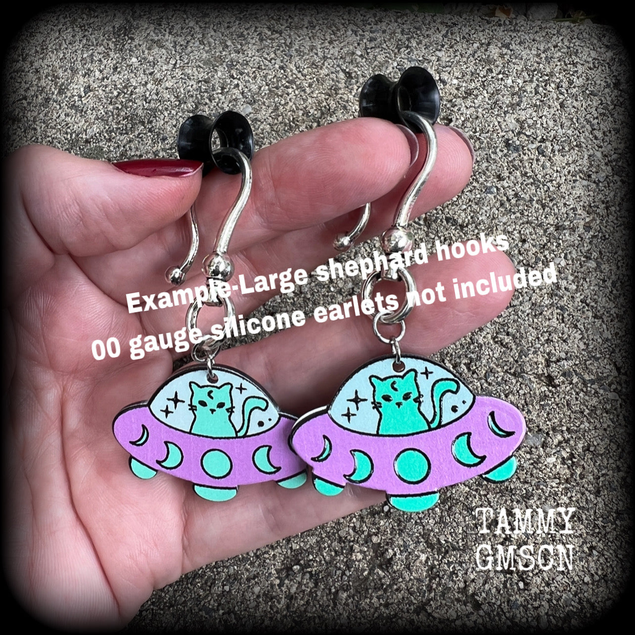 These adorable Space Cat earrings measure just under 5cms from tip to tip (nice and dangly), and weigh only 2 grams each (nice and light weight).
This pair has been made on antique silver large shephard hooks, suitable for stretched ears.