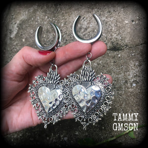 These gorgeous antique silver gauged earrings feature big beautiful sacred hearts, measuring 11cms from tip to tip, and weighing approx 21 grams each.

This pair has been made on 1" gauge (25mm) surgical steel cradles, to be worn in stretched lobes.