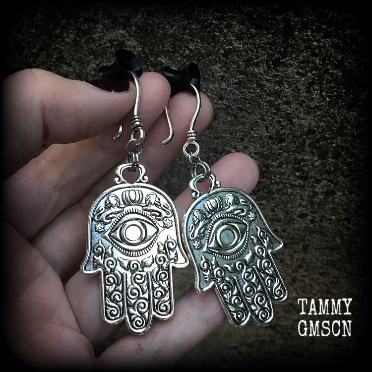 These antique silver Hamsa hand earrings weigh 10 grams each, measuring 7cms from tip to tip.
This pair has been made on small antique silver shephard hooks, suitable to be worn through stretched lobes with silicone earlets from 8 gauge (3mm).