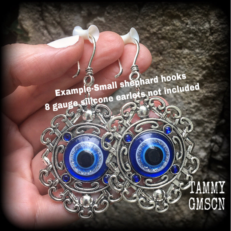 Evil eye earrings-Esoteric tunnel earrings