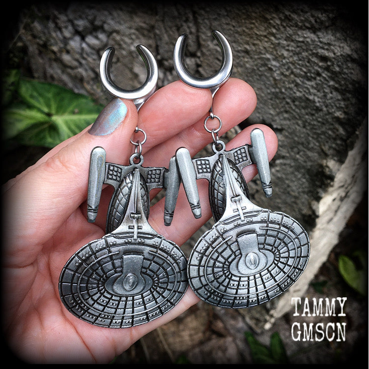 These awesome Star Trek USS Enterprise ear hangers feature a gorgeous big pewter Enterprise pendant, measuring just over 9cms from tip to tip, and weighing approx 37 grams each, nice and heavy.

This pair has been made on 5/8" gauge (16mm) surgical steel cradles, to be worn in stretched lobes.
