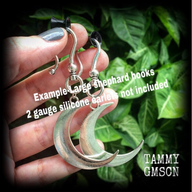 Crescent moon tunnel earrings