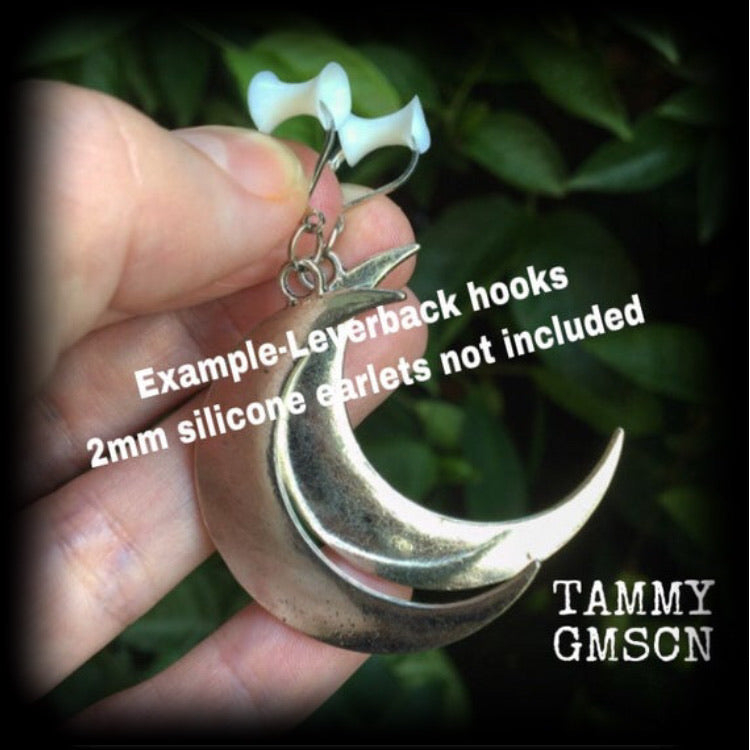 Crescent moon tunnel earrings