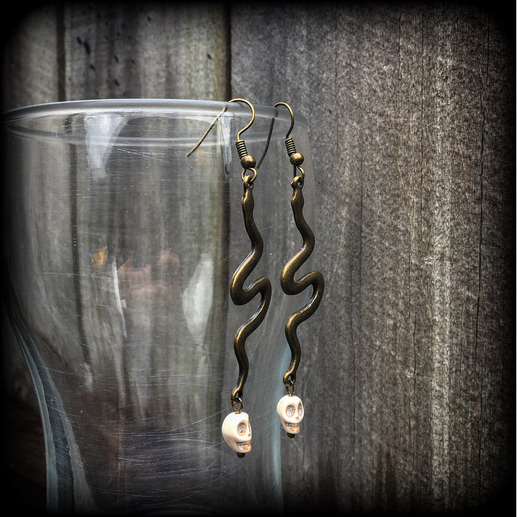 Bronze snake and stone skull earrings