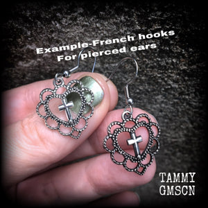 This pair of earrings features an ornate sacred heart with christian cross, nice and lightweight at just 2 grams a piece, and not too dangly, measuring just on 4cms from tip to tip.
This pair has been made with stainless steel french hooks, for pierced ears.