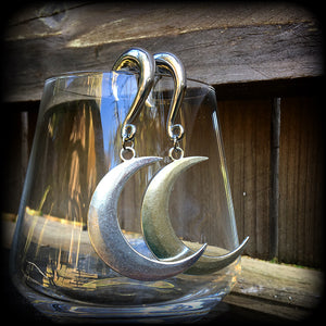 These gorgeously witchy antique silver 'Crescent moon' gauged earrings feature a classic antique silver crescent moon, measuring just under 8cms from tip to tip, and weighing approx 15 grams each.

This pair has been made on 0 gauge (8mm) surgical steel half curl hooks, to be worn in stretched lobes.