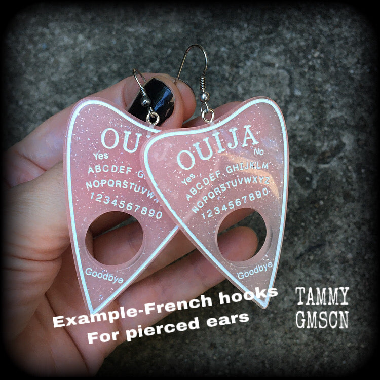 These gorgeous oversize pastel goth acrylic planchette earrings are big and dangly, weighing in at 8 grams each and measuring just under 8cms from tip to tip.

This pair have been made on stainless steel french hooks, suitable for pierced ears.