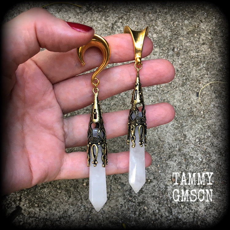 These gorgeous gothic gemstone gauged earrings feature beautiful cloudy quartz and antique bronze gemstone points, measuring just over 10 cms from tip to tip, and weighing approx 15 grams each.
These earrings have been made on 5/8" gauge (16mm) surgical steel saddles, to be worn in stretched lobes.